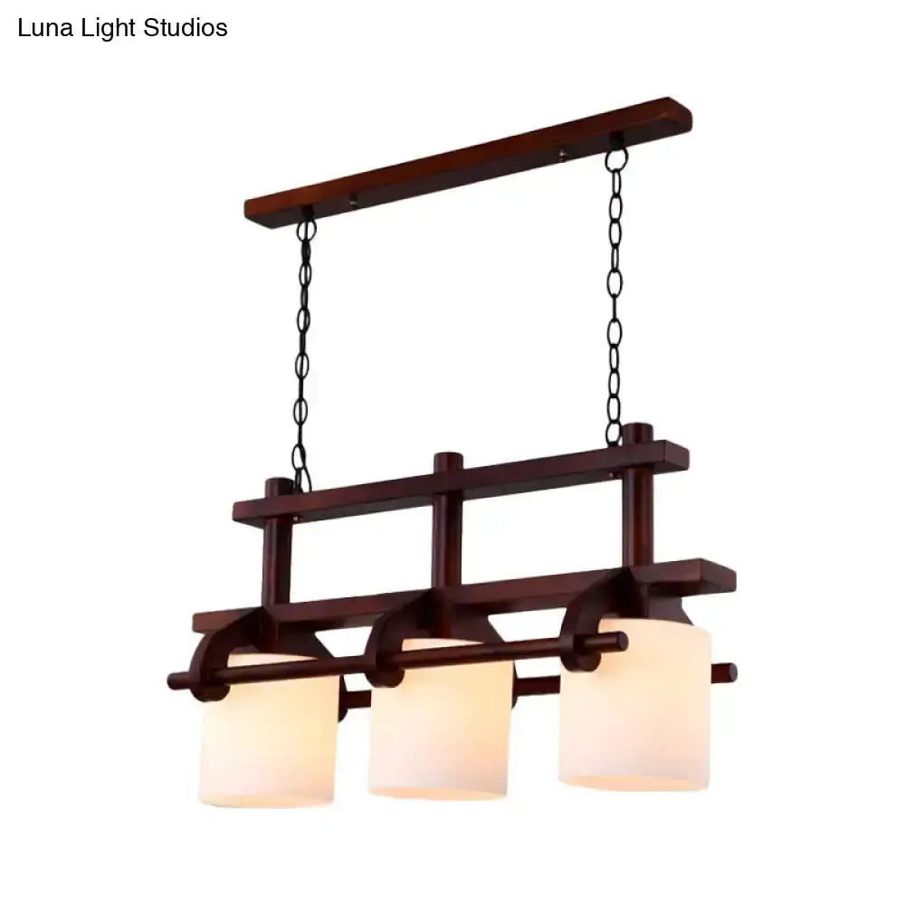 Decorbites rustic wood and white glass island pendant light with three cylindrical shades on Tampa Home & Garden Store