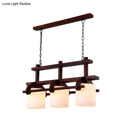 Decorbites rustic wood and white glass island pendant light with three cylindrical shades on Tampa Home & Garden Store