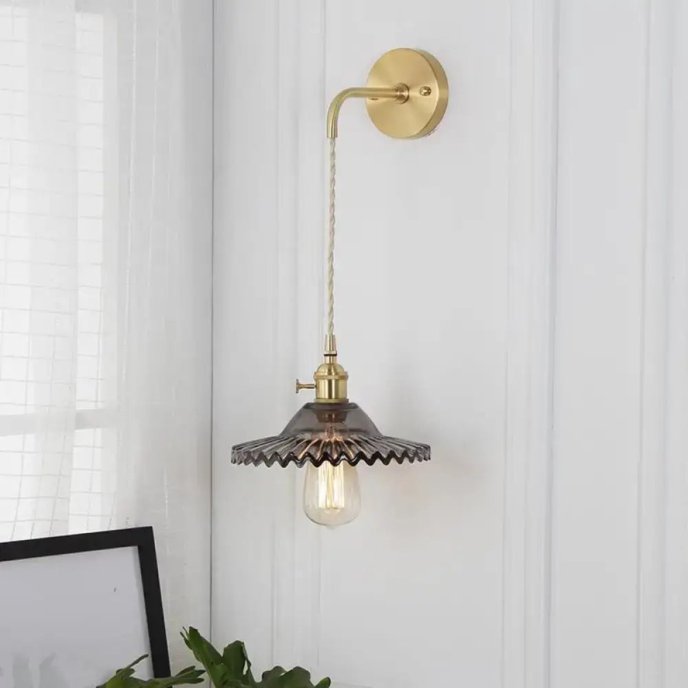 Smoked Glass Brass Sconce; wall mount, curved arm, scalloped smoked shade with Edison bulb on Tampa Home & Garden Store