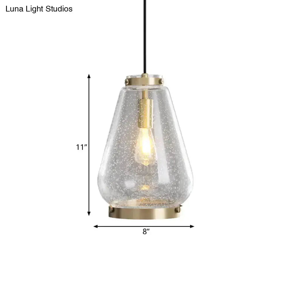 Modern seeded glass pendant light with brass rim, clear teardrop shade, 11in tall 8in wide on Tampa Home & Garden Store