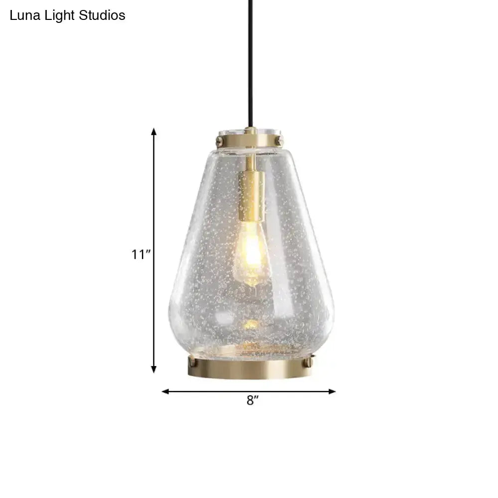 Modern seeded glass pendant light with brass rim by Decorbites on Tampa Home & Garden Store