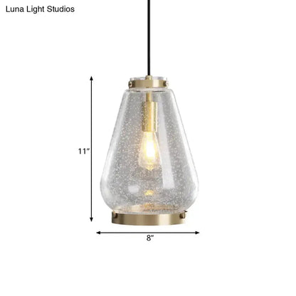 Modern seeded glass pendant light with brass rim by Decorbites on Tampa Home & Garden Store