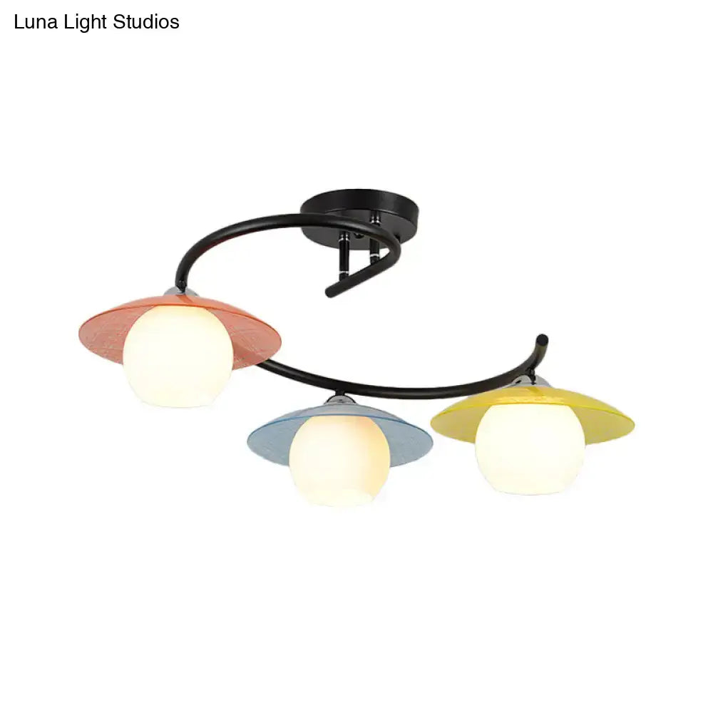 Saucer Semi-Flush Light by Decorbites, three colored saucer shades in red blue yellow on curved black bar on Tampa Home & Garden Store