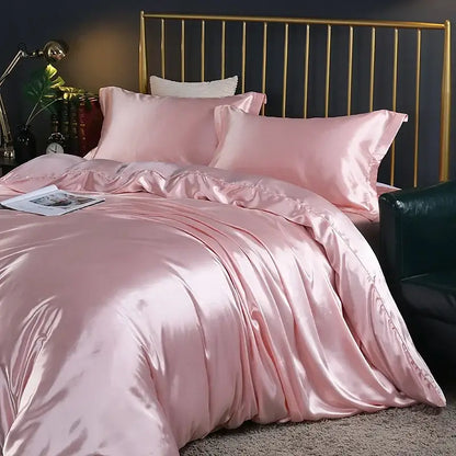 Pink satin bedding set with duvet cover and sheets by Decorbites on a gold metal bed frame on Tampa Home & Garden Store