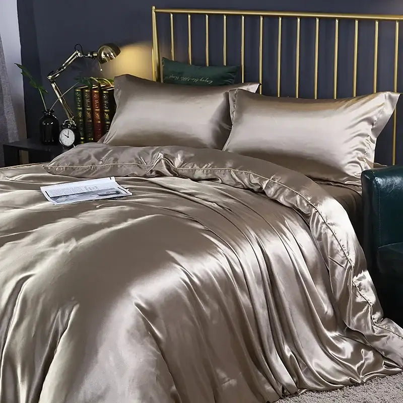 Decorbites pink satin bedding set with duvet and sheets on a bed with brass headboard on Tampa Home & Garden Store