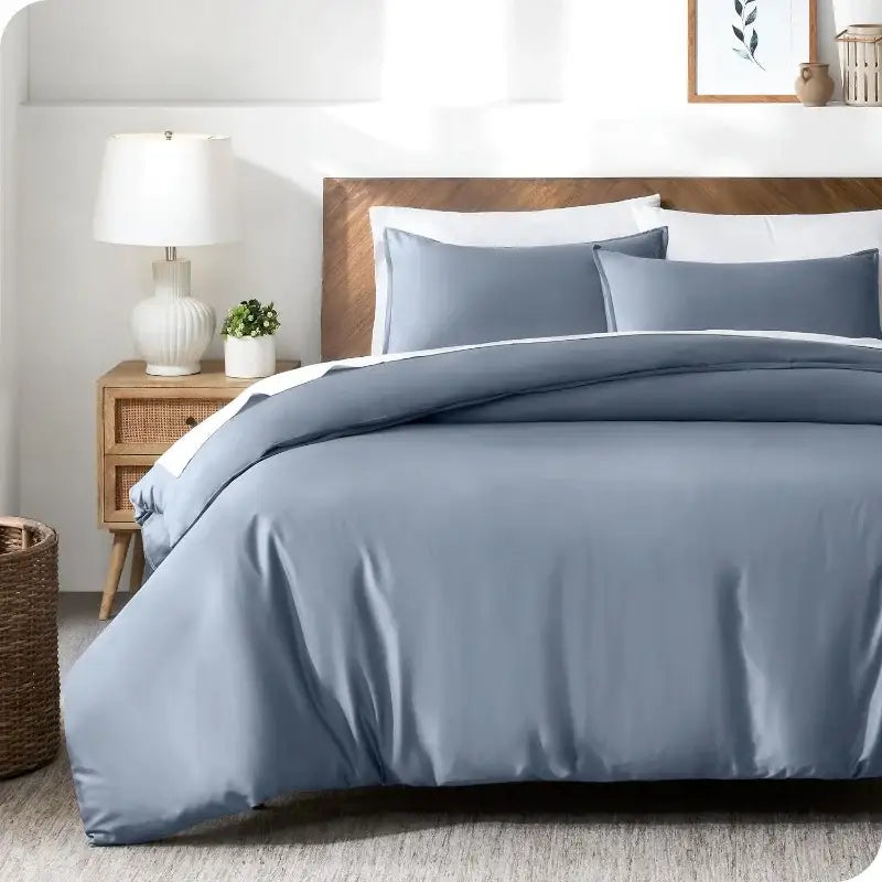 Blue satin Duvet Cover Set by Decorbites on bed with two blue pillow shams on Tampa Home & Garden Store