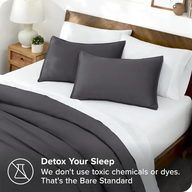 Blue satin duvet cover set by Decorbites with gray pillow shams on white bed on Tampa Home & Garden Store