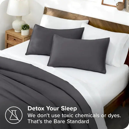 Blue satin duvet cover set by Decorbites with gray pillow shams on white bed on Tampa Home & Garden Store