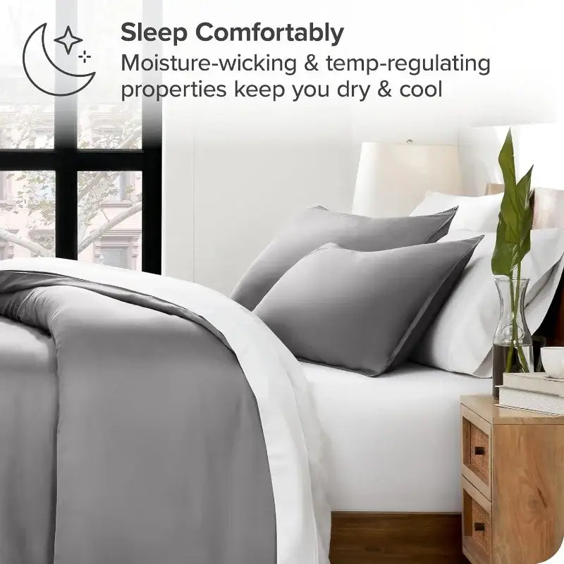 Blue satin duvet cover set by Decorbites on a bed with white sheets and gray pillows on Tampa Home & Garden Store