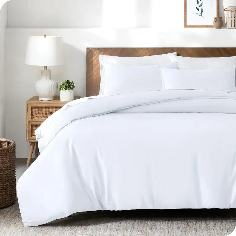 Blue Satin Duvet Cover Set on bed with white pillows and wooden headboard on Tampa Home & Garden Store