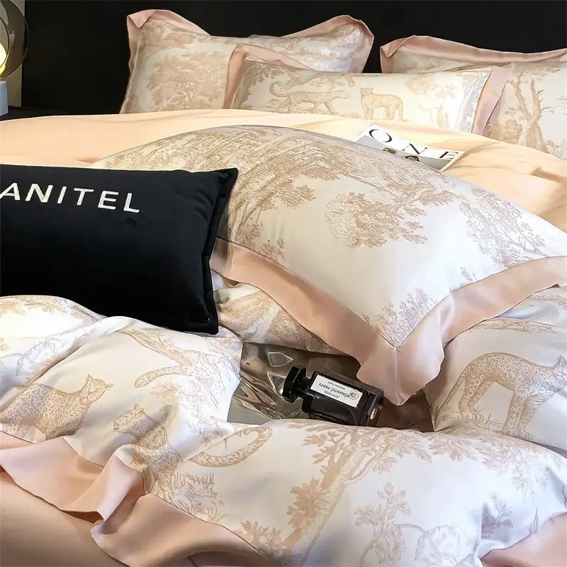 Blue Eucalyptus Duvet Cover with blush pink edging and toile print on bed with pillows on Tampa Home & Garden Store