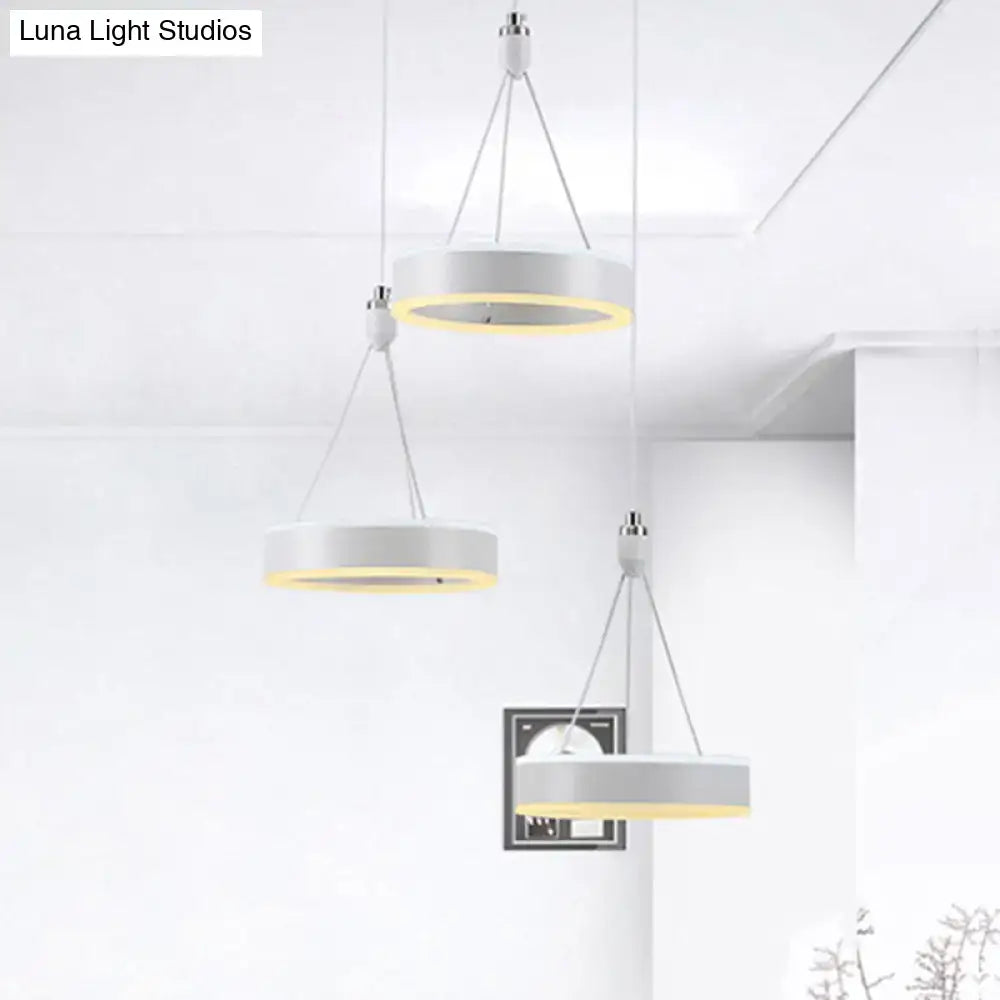 Silver cluster ceiling light with three white ring pendants and warm inner glow, Decorbites on Tampa Home & Garden Store