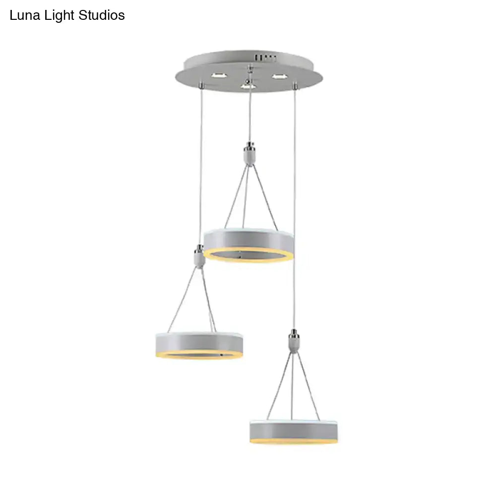 Silver cluster ceiling light with three hanging circular rings and gold accents Decorbites on Tampa Home & Garden Store