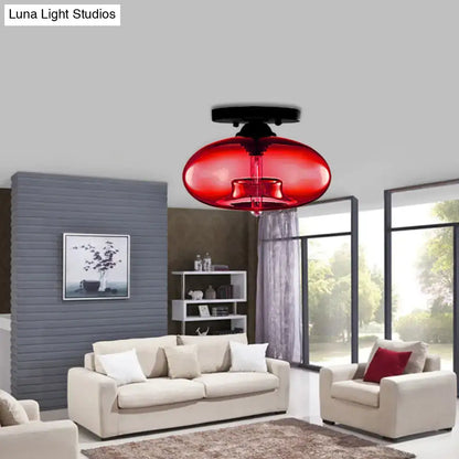 Glass Oval Flush Mount red glass ceiling light by Decorbites in a modern living room on Tampa Home & Garden Store