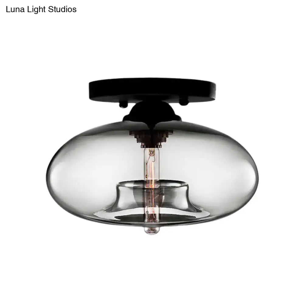 Glass oval flush mount light by Decorbites in clear smoked glass with black ceiling plate on Tampa Home & Garden Store