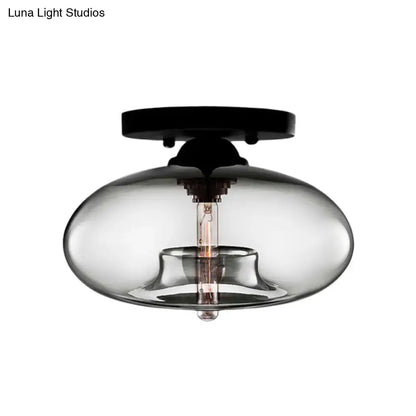Glass oval flush mount light by Decorbites in clear smoked glass with black ceiling plate on Tampa Home & Garden Store