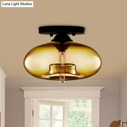 Glass Oval Flush Mount light with amber glass shade and black canopy on Tampa Home & Garden Store