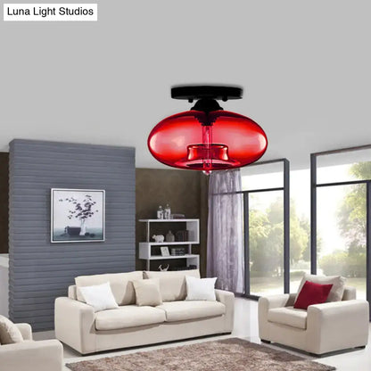 Glass Oval Flush Mount red glass ceiling light by Decorbites in a modern living room on Tampa Home & Garden Store