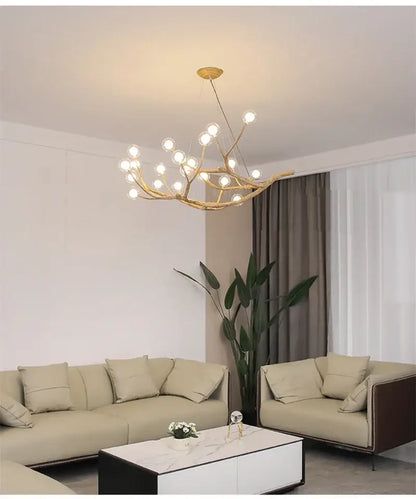 Chandelier Decorbites golden iron tree-branch bubble chandelier with bulbs over beige sofas on Tampa Home & Garden Store