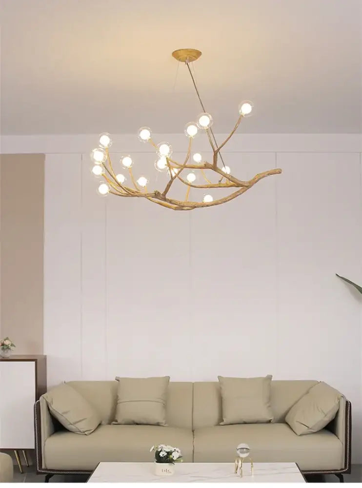 Golden iron tree branch bubble chandelier by Decorbites with multiple bulbs on Tampa Home & Garden Store
