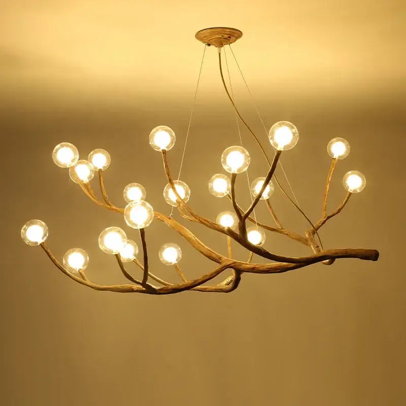 Chandelier Decorbites golden iron tree-branch with globe bulbs for dining room on Tampa Home & Garden Store