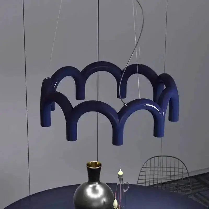 Decorbites modern black U-shaped chandelier with looping arches, ceiling-hung over dining table on Tampa Home & Garden Store