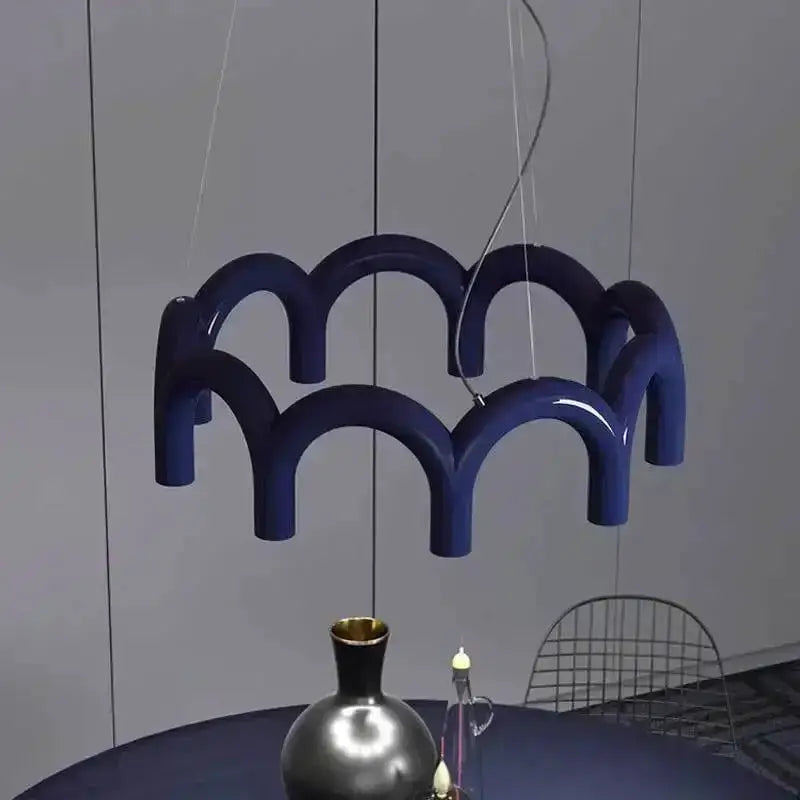 Chandelier Decorbites modern black U-shaped design with looping arches over dining area on Tampa Home & Garden Store