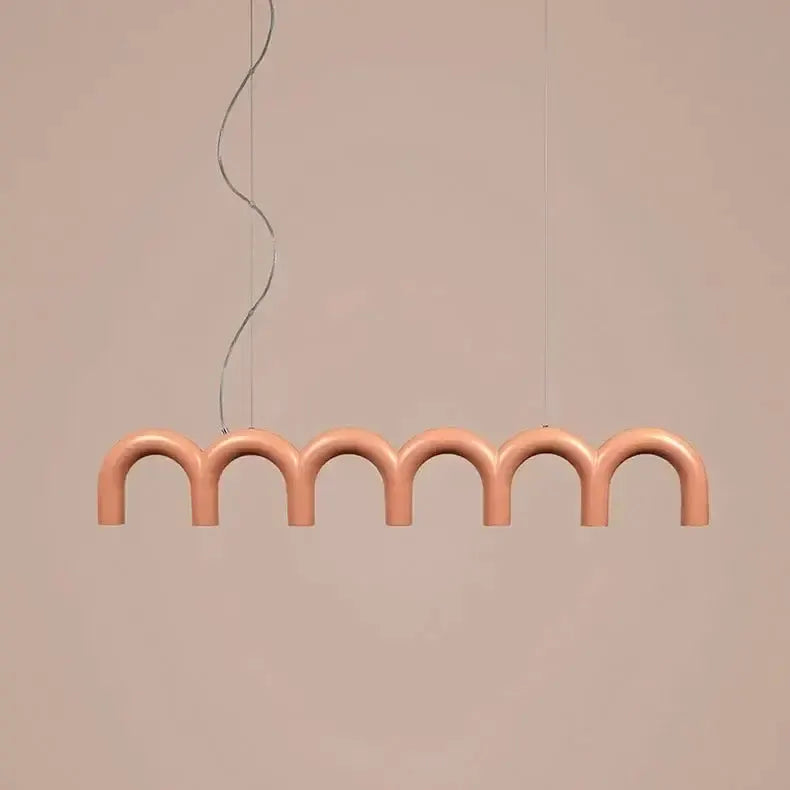 Modern pink U-shaped chandelier with seven arches in a linear pendant design on Tampa Home & Garden Store