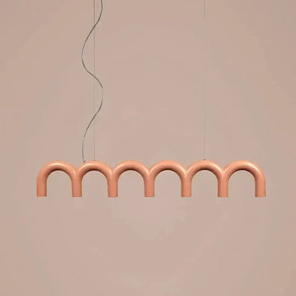 Modern pink U-shaped chandelier with seven arches in a linear pendant design on Tampa Home & Garden Store