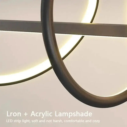 Sleek wavy pendant light with brushed metal finish and iron ring LED glow by Decorbites on Tampa Home & Garden Store