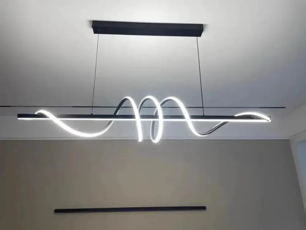 Sleek wavy pendant lights for dining room with brushed metallic finish by Decorbites on Tampa Home & Garden Store