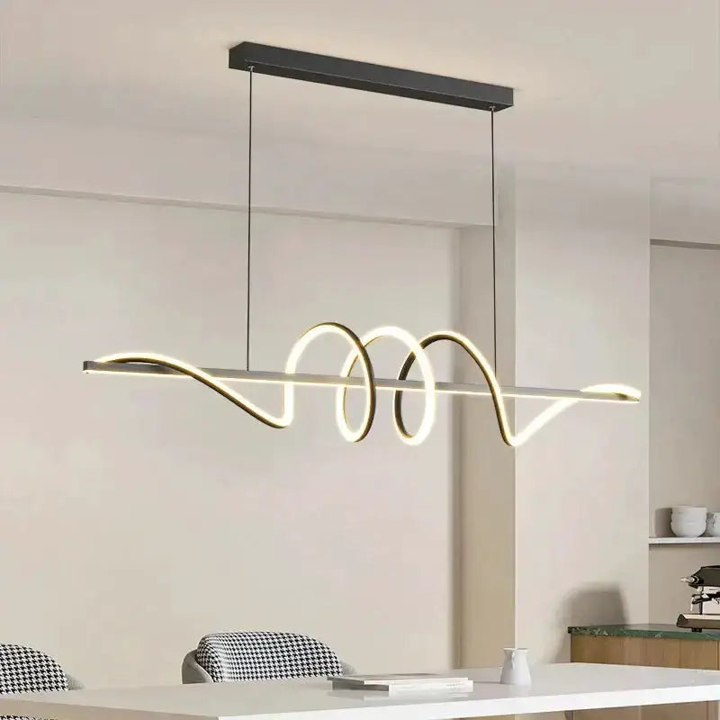 Sleek wavy pendant light by Decorbites in brushed metallic finish for dining room on Tampa Home & Garden Store