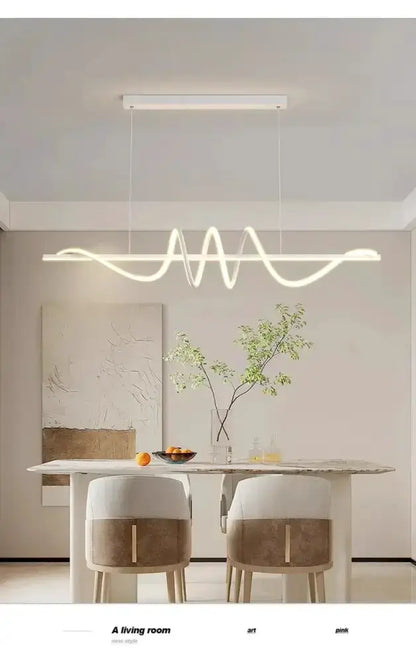 Sleek wavy pendant light by Decorbites, brushed metallic finish for dining room on Tampa Home & Garden Store