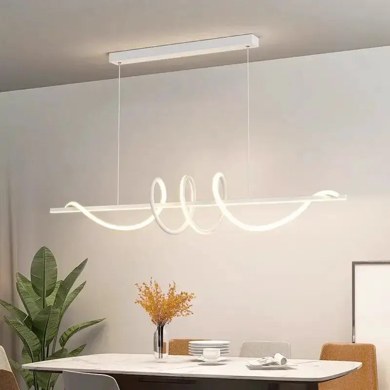 Sleek wavy pendant lights by Decorbites with LED loops over dining table on Tampa Home & Garden Store
