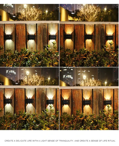 Black solar wall light set of four by Decorbites along a wooden fence with warm glow on Tampa Home & Garden Store