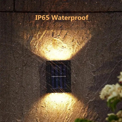 Black solar wall light Decorbites; IP65 waterproof outdoor fixture with solar panel on Tampa Home & Garden Store