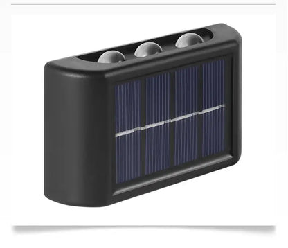 Black solar wall light Decorbites outdoor lighting with front solar panel and three dome LEDs on top on Tampa Home & Garden Store