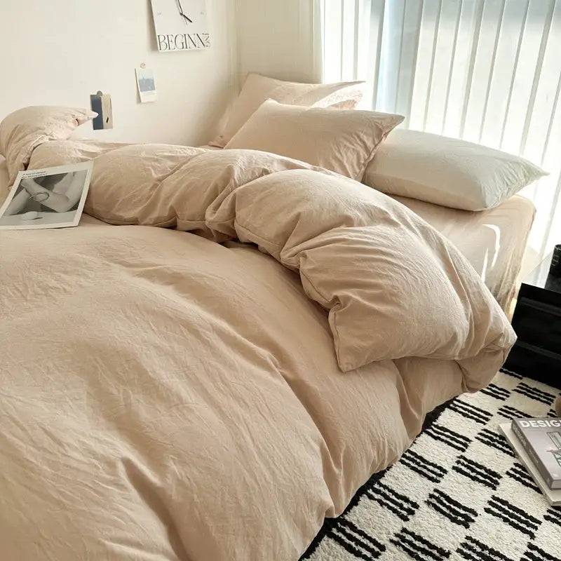 Gray quilted cotton duvet cover set by Decorbites on bed with beige pillows on Tampa Home & Garden Store