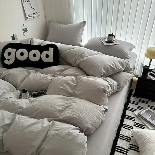 Gray quilted cotton duvet cover bedding set by Decorbites on a bed with pillows on Tampa Home & Garden Store