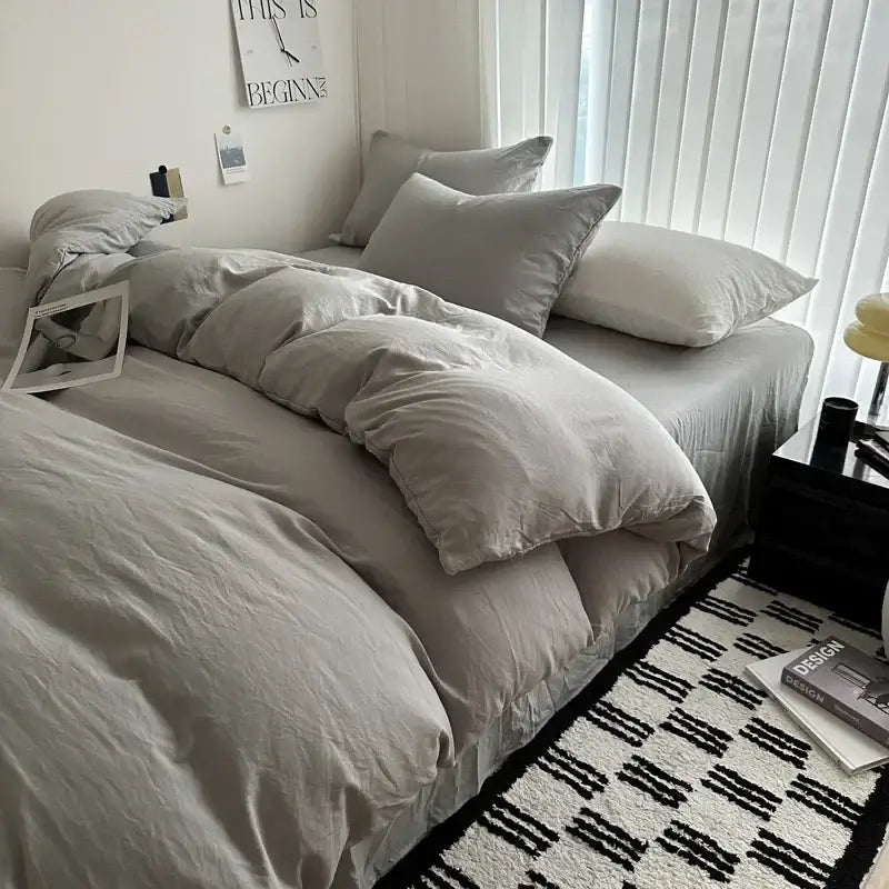 Gray quilted cotton duvet cover bedding set by Decorbites on bed with pillows on Tampa Home & Garden Store