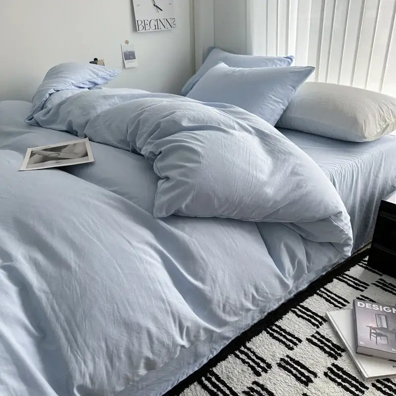 Decorbites gray quilted cotton duvet cover bedding set on bed with light blue pillows on Tampa Home & Garden Store
