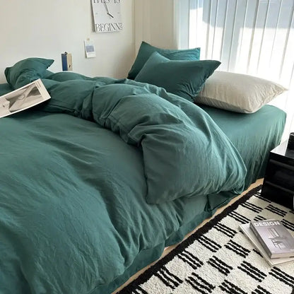Decorbites gray quilted cotton duvet cover bedding set on bed with teal pillows on Tampa Home & Garden Store
