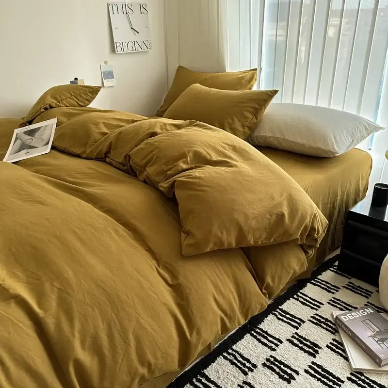 Mustard quilted cotton duvet cover set on bed with matching pillow shams by Decorbites on Tampa Home & Garden Store