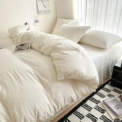 Gray quilted cotton duvet cover set by Decorbites on white bed with plush pillows on Tampa Home & Garden Store
