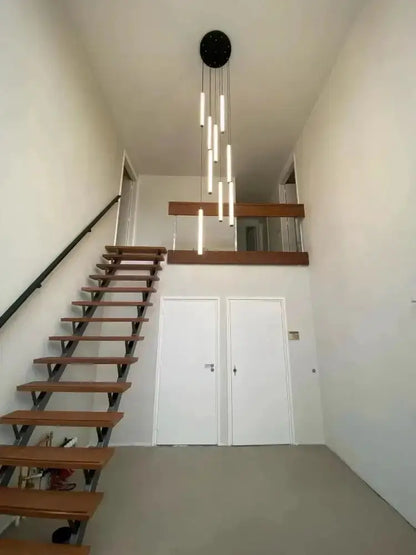 Chandelier Modern black spiral LED pendant light with vertical tubes above a stairwell on Tampa Home & Garden Store