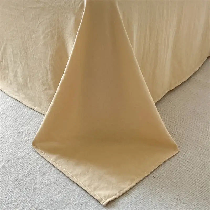Decorbites cream striped quilted duvet cover draped over bed edge on Tampa Home & Garden Store