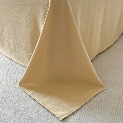 Decorbites cream striped quilted duvet cover draped over bed edge on Tampa Home & Garden Store