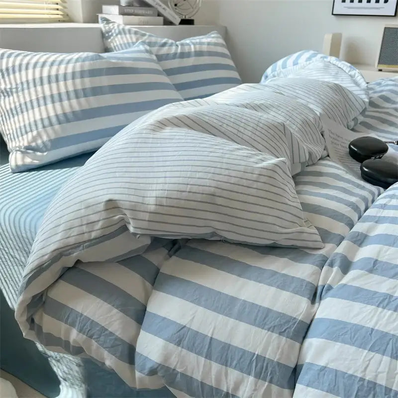 Decorbites quilted striped duvet cover set in blue and white with matching pillowcases on Tampa Home & Garden Store