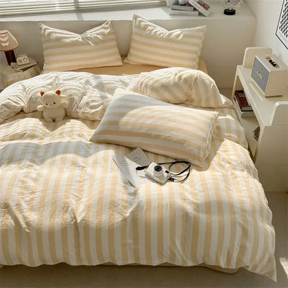Cream striped quilt duvet cover by Decorbites in a sunlit bedroom with matching striped pillows on Tampa Home & Garden Store