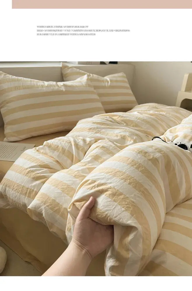 Cream striped quilted quilt by Decorbites, beige and cream duvet cover on bed on Tampa Home & Garden Store